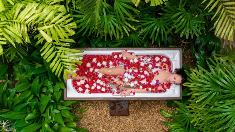 Girl relaxing in a flower bath