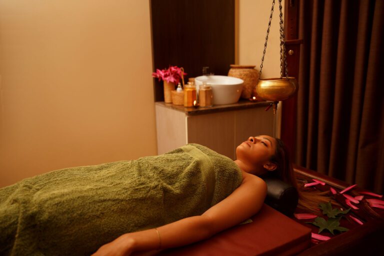 A lady prepped for a herbal wellness treatment