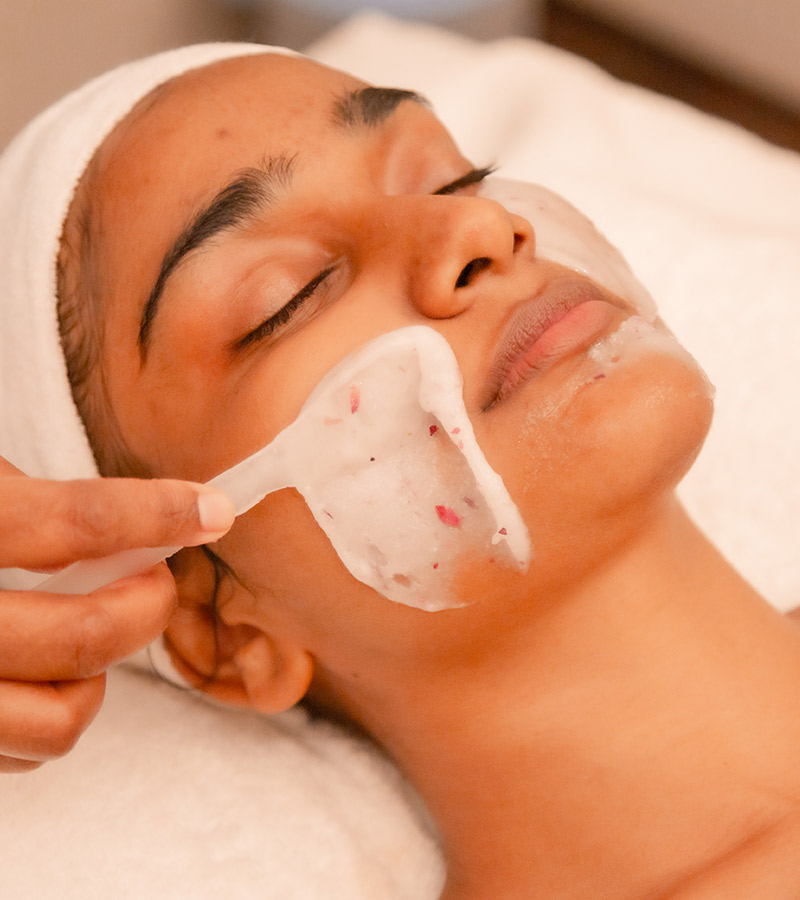 A patient undergoing a facial treatment