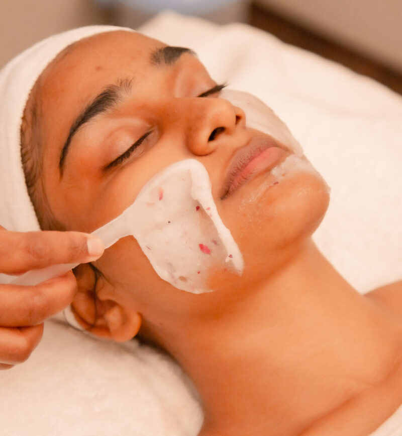 A lady receiving a facial treatment